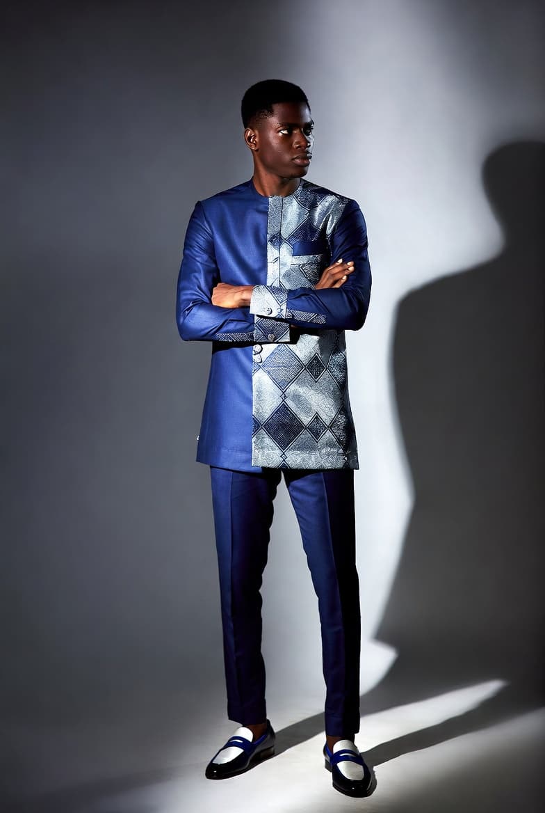 A finished tailored indigo suit with an Ankara panelled jacket, shot in the studio